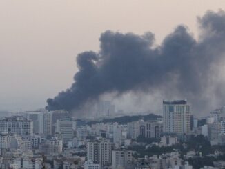 Smoke rises from a building belonging to the Iranian state broadcaster in Tehran after an Israeli strike