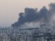 Smoke rises from a building belonging to the Iranian state broadcaster in Tehran after an Israeli strike