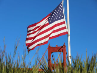 An American flag near the Golden Gate Bridge in San Francisco, California.
