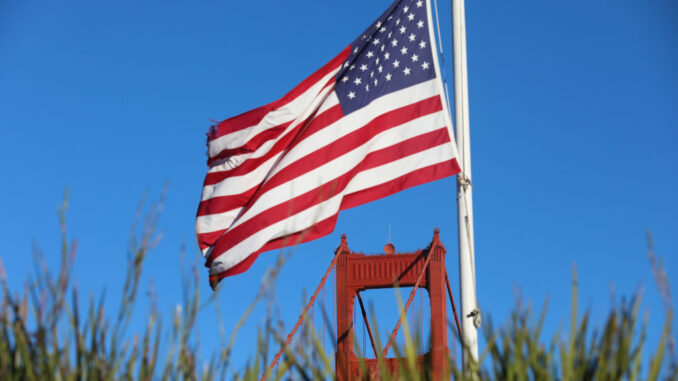 Trump's AI Action Plan aims to block chip exports to An American flag near the Golden Gate Bridge in San Francisco, California.