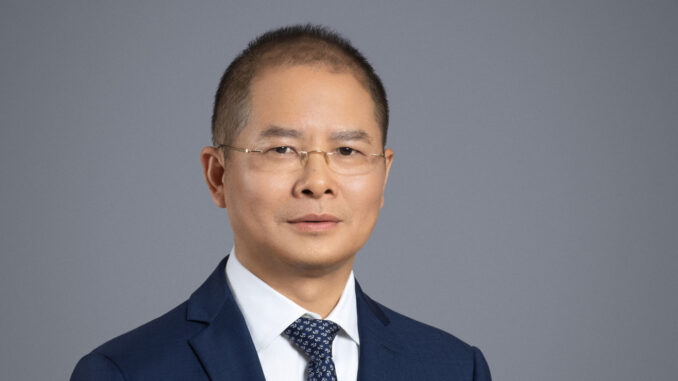 Article illustration of Eric Xu of Huawei. Article concerns new Ascend chip range from the company.