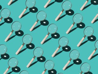 Magnifying Glass Focusing Sunlight Into a Point Repetition on Turquoise Colored Background High Angle View.