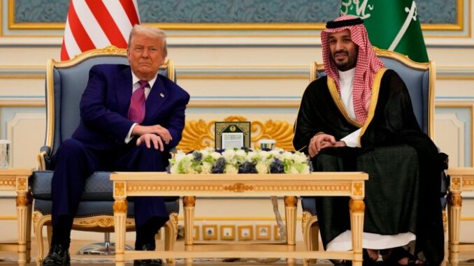 President Donald Trump and Saudi Crown Prince Mohammed bin Salman sit side by side during a meeting at the Royal Palace.