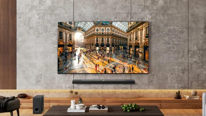 LG's 83-inch OLED B5 2025 TV. mounted onto a gray wall.