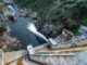 a photo of a dam in Spain seen spilling water.