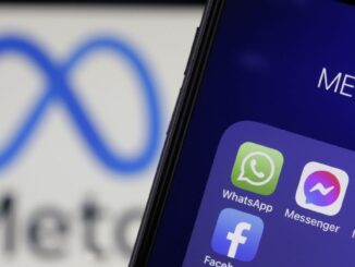 In this photo illustration, the icons of WhatsApp, Messenger, Instagram and Facebook are displayed on an iPhone in front of a Meta logo