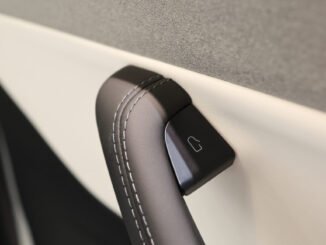 The interior door handle of a Tesla Model 3 electric vehicle at a pop-up Tesla Inc. store on its opening day in Riga, Latvia, on Friday, Aug. 21, 2026. Tesla Inc. and at least eight other carmakers are recalling millions of cars in China over safety concerns with their door handles. Photographer: Andrey Rudakov/Bloomberg via Getty Images