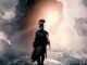 poster art showing an Ithacan soldier in full armor standing against a backdrop of sea spray and a giant rearing horse